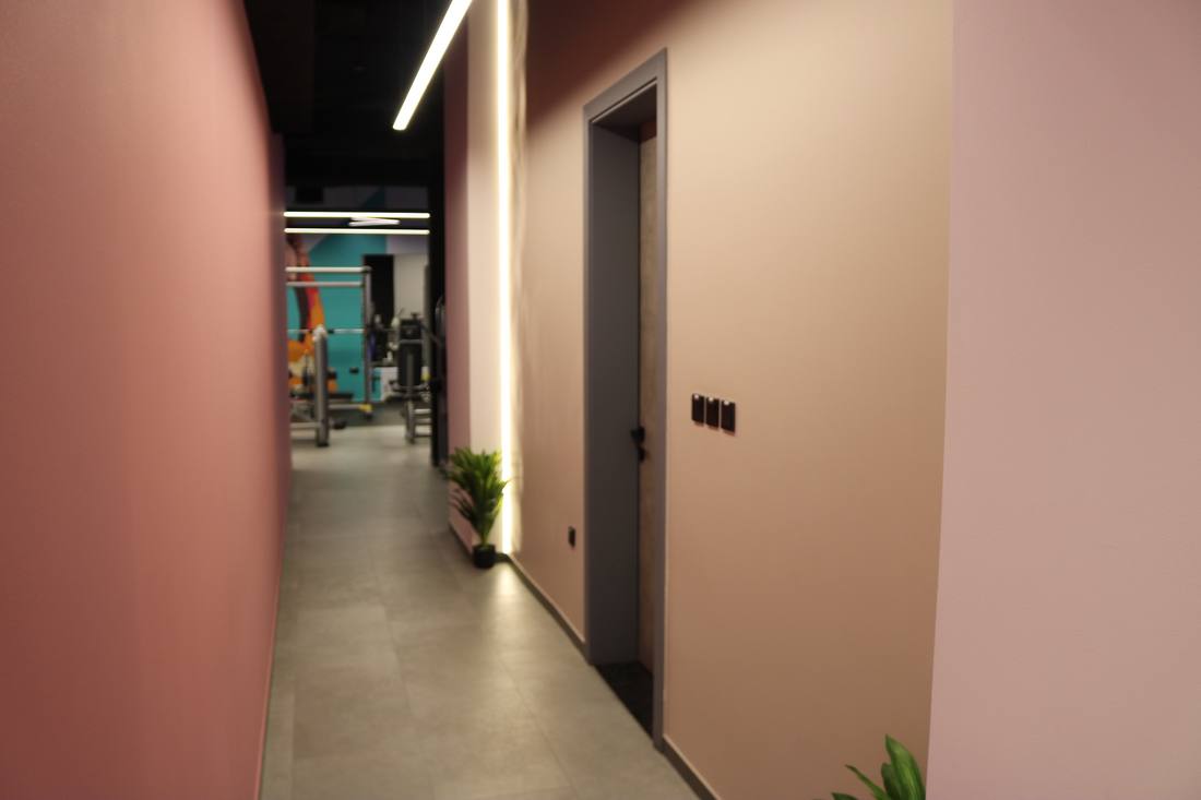 Warm lit corridor into the gym